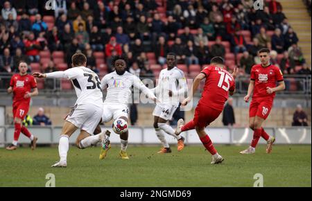 Leyton Orient's Idris El Mizouni shoots to score his side's first goal despite the tackle of Crawley Town's Tom Fellows, left and Aramide Oteh during the Sky Bet League One match at Brisbane Road, London. Picture date: Saturday February 18, 2023. Stock Photo