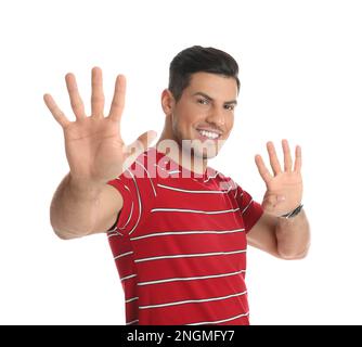 Man showing number nine with his hands on white background Stock Photo