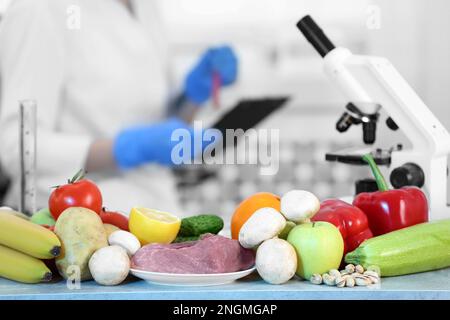 Fresh vegetables, fruits and meat on table in laboratory. Food quality control Stock Photo