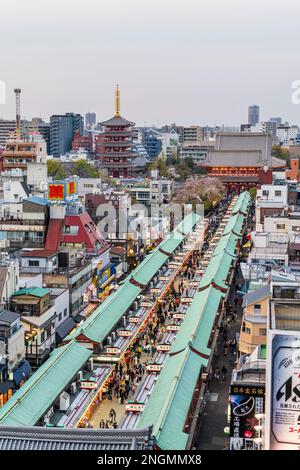 Tokyo. Asakusa shrine and Sensoji temple and pagoda at end of the Nakamise, a crowded souvenir shopping street leading to the second gate. Blue hour. Stock Photo