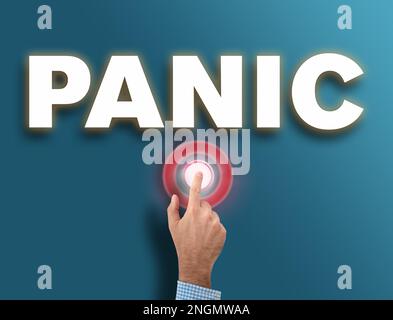 male hand pushing red glowing panic button, danger and hysteria reaction concept Stock Photo