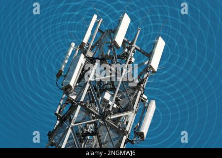 Sendemast & Strahlung. High radio mast with visible electrosmog Stock Photo