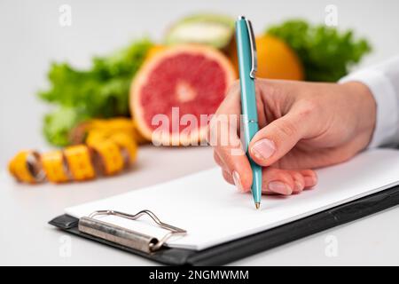 woman writing blurred fruit. Beautiful photo Stock Photo