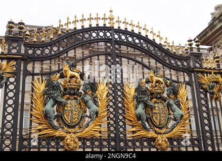 beautiful royal insignia of the Royal British family on the gates of Buckingham Palace, a London royal residence and the administrative headquarters Stock Photo