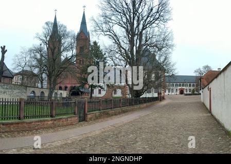 Front yard of the former Benedictine abbey, Basilica of Saints Marcellinus and Peter, aka Einhard-Basilika, in the background, Seligenstadt, Germany Stock Photo
