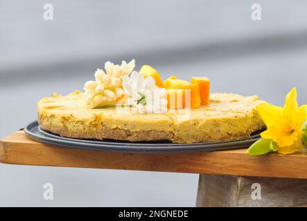 Healthy RAW  mango cake at the Naplavka farmers street food market on the waterfront of the Vltava River in Prague. Stock Photo