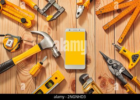 Mock Up Big Set Of Yellow Construction Tools Smartphone With Free Space For Your Text Stock Photo