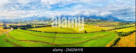 Scenic arial panorama of argiculture cultivated sheep farms in The Key of New Zealand south island. Stock Photo