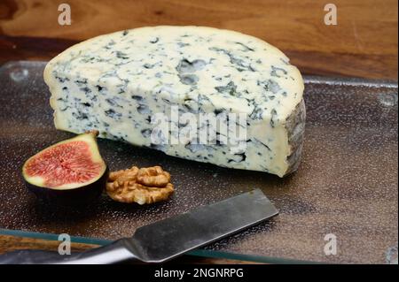 Cheese collection, piece of French blue cheese auvergne or fourme d'ambert close up Stock Photo
