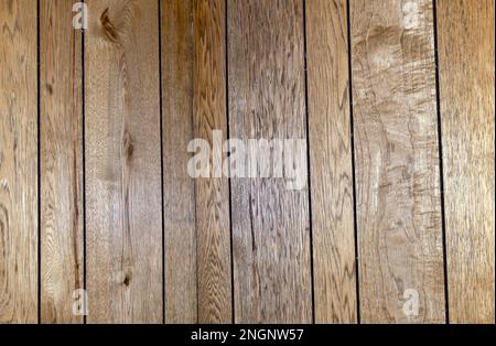 Brown paneling with wood grain and straight lines makes a nice background or texture and offers copy space. A nice rustic flair. Stock Photo