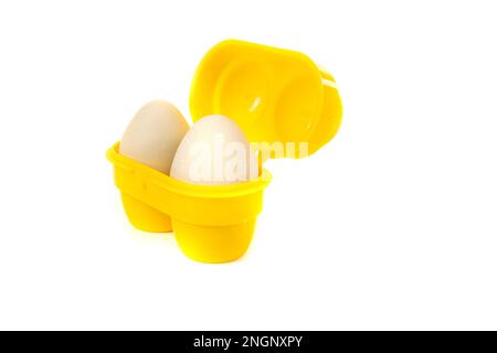 Green farm fresh eggs in a small camping container Stock Photo