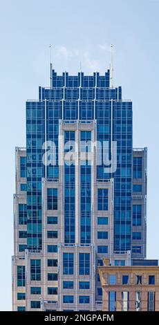 Blue glass caps the cast stone tower of State Street  Financial Center (1 Lincoln Street). East façade shown. Stock Photo