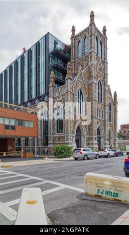 The Lucas is an eight-story glass-and-steel residential condo built inside the restored shell of a gothic-styled stone church in Boston’s South End. Stock Photo