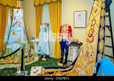 The Mardi Gras trains and regalia of the 2022 juvenile Mardi Gras monarchs are displayed at Mobile Carnival Museum in Mobile, Alabama. Stock Photo