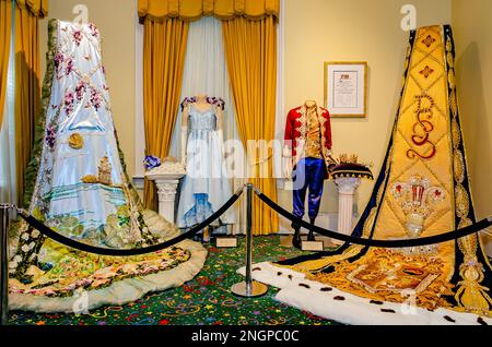 The Mardi Gras trains and regalia of the 2022 juvenile Mardi Gras monarchs are displayed at Mobile Carnival Museum in Mobile, Alabama. Stock Photo