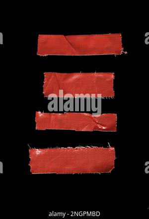 Set of pieces of general purpose vinyl red tape isolated on black Stock Photo