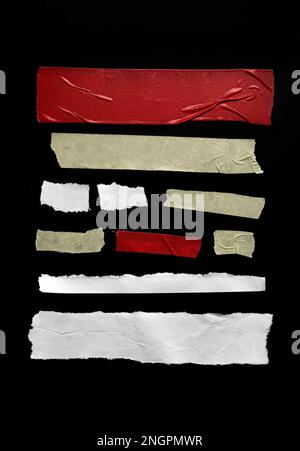 Set of pieces of general purpose tape and crumpled papers isolated on black, design elements Stock Photo