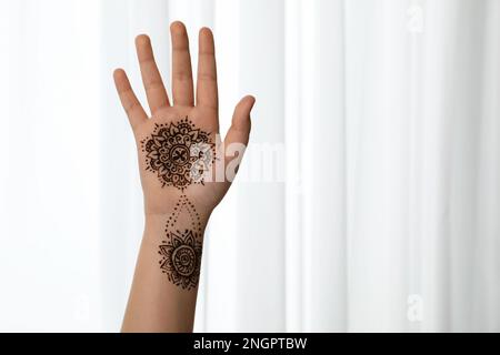 Little girl with henna tattoo on palm, closeup and space for text.  Traditional mehndi ornament Stock Photo - Alamy