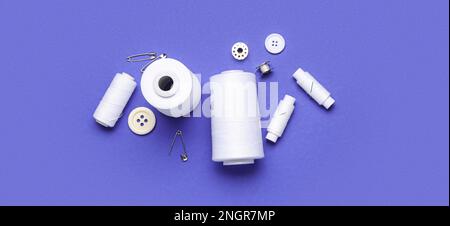 Set of different sewing supplies on blue background Stock Photo