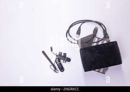 Pen drives also called flash drives used to store data from computer kept along with hard disk drives and solid-state drives on a white background. Stock Photo