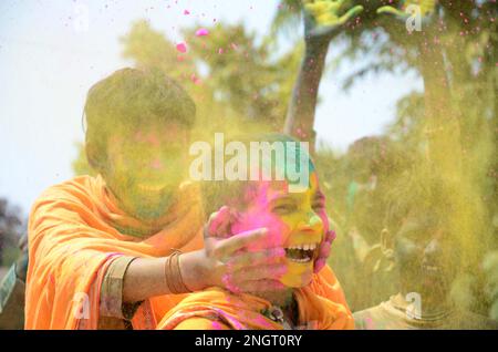 India, Madhya Pradesh, Jabalpur : Ved Pathi students smearing 'gulal' powder on each other's faces as they celebrate Holi festival at Narmada Ved Vigyan sanskrit Vidyalaya in Jabalpur. Photo by - Uma Shankar Mishra Stock Photo