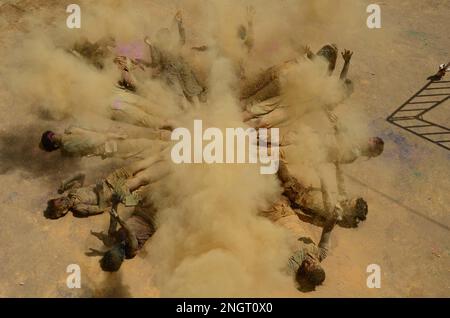 India, Madhya Pradesh, Jabalpur : Ved Pathi students smearing 'gulal' powder on each other's faces as they celebrate Holi festival at Narmada Ved Vigyan sanskrit Vidyalaya in Jabalpur. Photo by - Uma Shankar Mishra Stock Photo