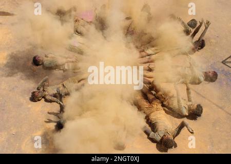 India, Madhya Pradesh, Jabalpur : Ved Pathi students smearing 'gulal' powder on each other's faces as they celebrate Holi festival at Narmada Ved Vigyan sanskrit Vidyalaya in Jabalpur. Photo by - Uma Shankar Mishra Stock Photo