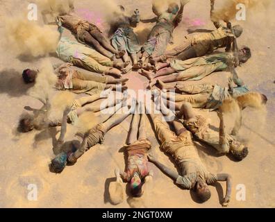 India, Madhya Pradesh, Jabalpur : Ved Pathi students smearing 'gulal' powder on each other's faces as they celebrate Holi festival at Narmada Ved Vigyan sanskrit Vidyalaya in Jabalpur. Photo by - Uma Shankar Mishra Stock Photo