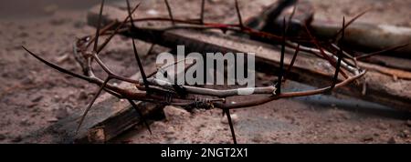 Jesus Christ  Hammer And Bloody Nails And Crown Of Thorns  on dark Background. Easter symbol concept. Stock Photo