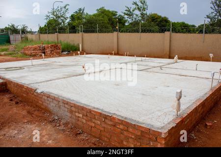 Diagonal view of the concrete slab foundation for a new building under construction. Stock Photo