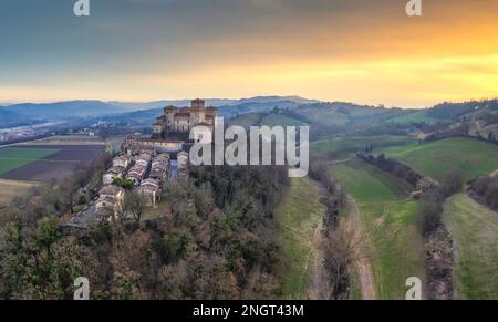 Panoramic aerial view of Torrechiara Castle during winter sunset. Parma, Italy. Stock Photo