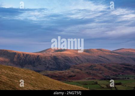 Wonderful sunset landscape image of view from Latrigg Fell towards Great Dodd and Stybarrow Dodd in Lake District Stock Photo