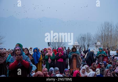 Srinagar, India. 19th Feb, 2023. Muslim devotees pray as the head priest displays the holy relic on the occasion of ''Israa and Miraj'' at Hazratbal shrine in Srinagar. Muslims in Kashmir thronged to Hazratbal Shrine to offer congregational prayers and to get glimpse of relic believed to be from beard of Islamic Prophet Muhammad, marking the 'Israa and Miraj', the day on which, according to Islam, the prophet Mohammed left Mecca for Jerusalem, from where he ascended to heaven (Photo by Idrees Abbas/SOPA Images/Sipa USA) Credit: Sipa USA/Alamy Live News Stock Photo