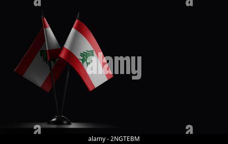 Small national flags of the Lebanon on a black background. Stock Photo