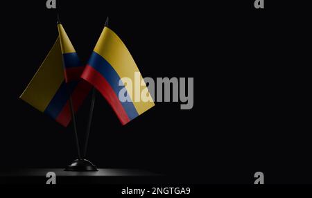 Small national flags of the Colombia on a black background. Stock Photo