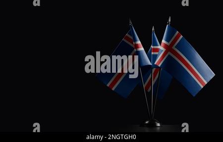 Small national flags of the Iceland on a black background. Stock Photo