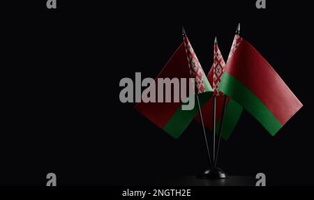Small national flags of the Belarus on a black background. Stock Photo
