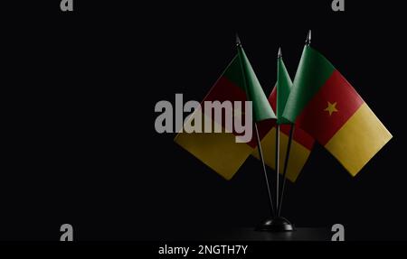 Small national flags of the Cameroon on a black background. Stock Photo