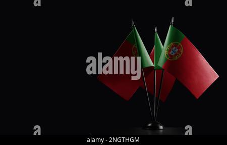 Small national flags of the Portugal on a black background. Stock Photo