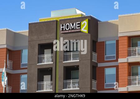 Galveston, Texas - February 2023: Sign on the outside of the Home 2 suites hotel, which is part of the Hilton chain of hotels Stock Photo