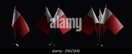 Small national flags of the Malta on a black background. Stock Photo