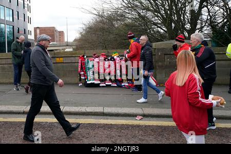 Manchester, UK. 19th Feb, 2023. Scarf seller outside the ground during the Premier League match at Old Trafford, Manchester. Picture credit should read: Andrew Yates/Sportimage Credit: Sportimage/Alamy Live News Stock Photo