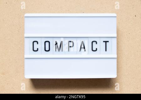 Lightbox with word compact on wood background Stock Photo