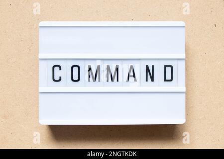 Lightbox with word command on wood background Stock Photo