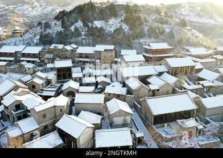 Beijing, China. 19th Feb, 2023. This aerial photo taken on Feb. 19, 2023 shows snow scenery of the Gubei Water Town in Beijing, capital of China. Credit: Chen Yehua/Xinhua/Alamy Live News Stock Photo
