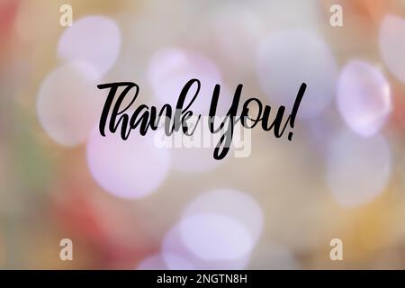 Background with the words Thank you! on a blurred light background Stock Photo