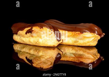 Two chocolate eclairs, macro, isolated on black background. Stock Photo