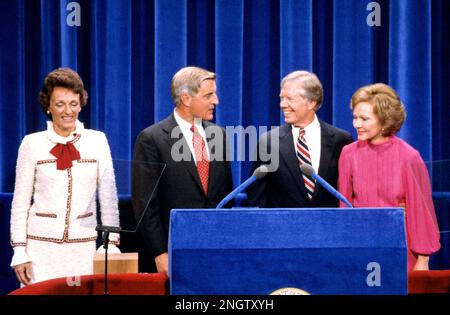 United States President Jimmy Carter, center right, and US Vice President Walter Mondale, center left, and their wives, first lady Rosalynn Carter, right, and Joan Mondale, left, on the podium after delivering their acceptance speeches at the 1980 Democratic National Convention in Madison Square Garden in New York, New York on August 13, 1980. Credit: Arnie Sachs/CNP/Sipa USA Credit: Sipa USA/Alamy Live News Stock Photo