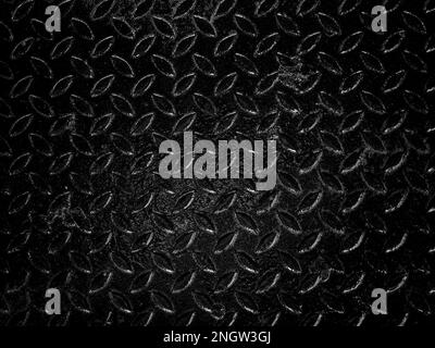 Blank space on black metallic checker plate anti-slip texture background. Abstract black metal sheet, close-up texture, black and white style. Stock Photo