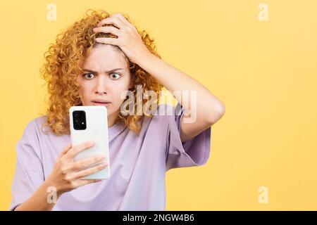 A desperate woman looking at mobile phone Stock Photo